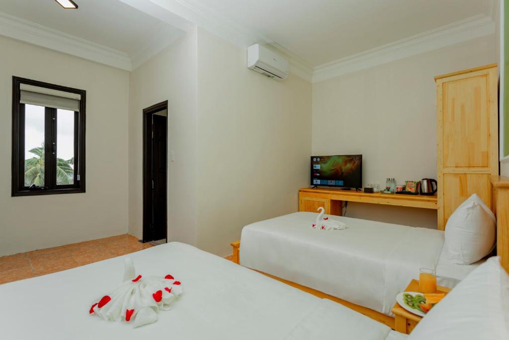 TV a/nebo společenská místnost v ubytování Sea and Sand Hotel