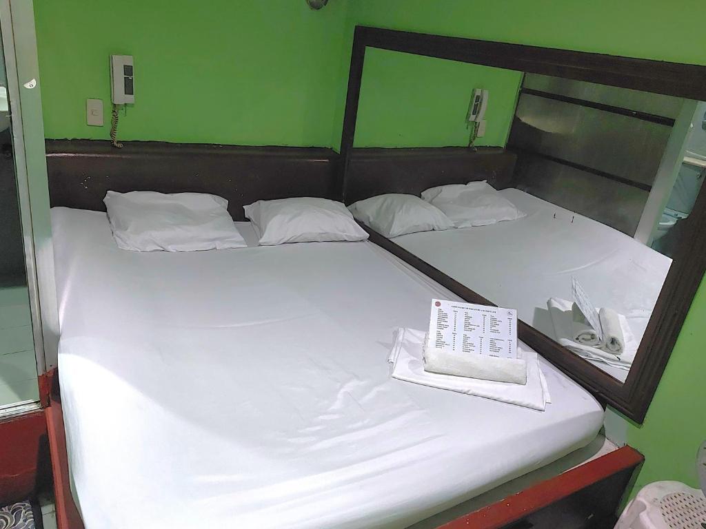 Postel nebo postele na pokoji v ubytování MCT Hotel