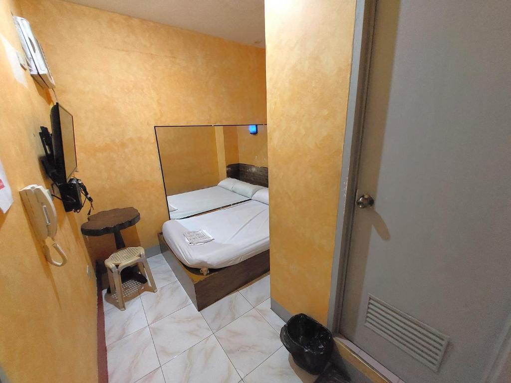 Postel nebo postele na pokoji v ubytování MCT Hotel