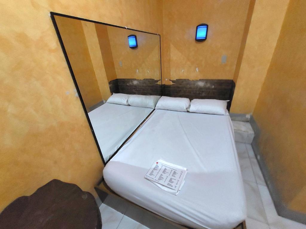 Postel nebo postele na pokoji v ubytování MCT Hotel