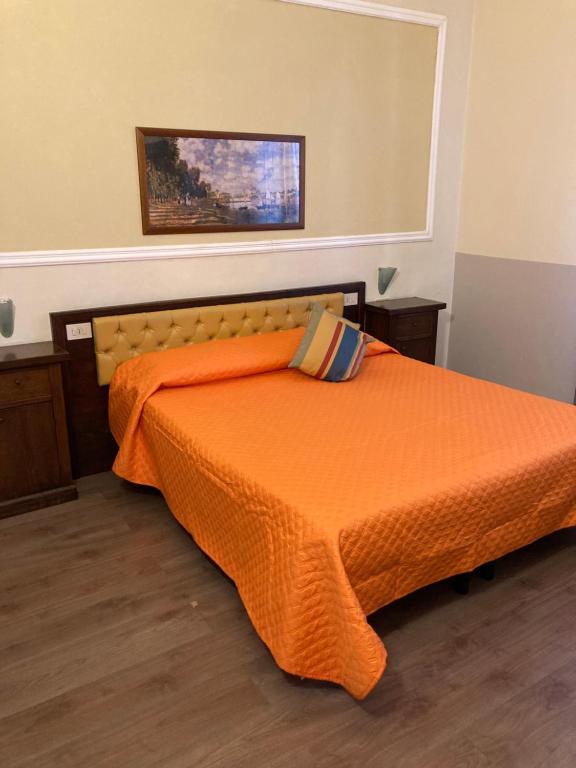 Postel nebo postele na pokoji v ubytování Hotel Minerva