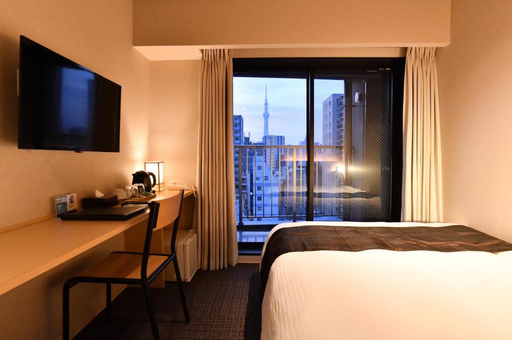 Postel nebo postele na pokoji v ubytování FL Hotel Asakusa