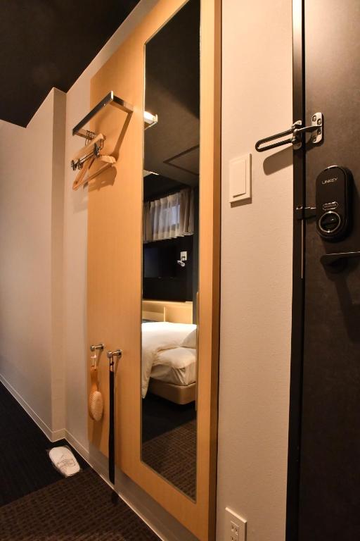 Postel nebo postele na pokoji v ubytování FL Hotel Asakusa