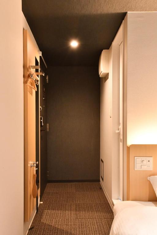 Postel nebo postele na pokoji v ubytování FL Hotel Asakusa