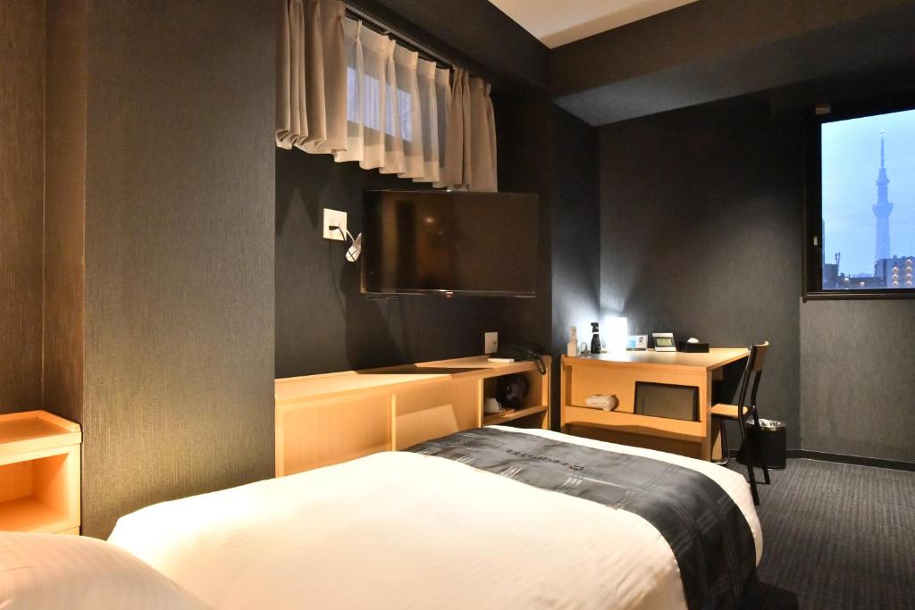 Postel nebo postele na pokoji v ubytování FL Hotel Asakusa