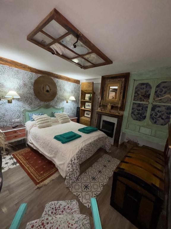 a bedroom with a large bed in a room at Casa rural en Buendía -la Galera con 4 dormitorios in Buendía