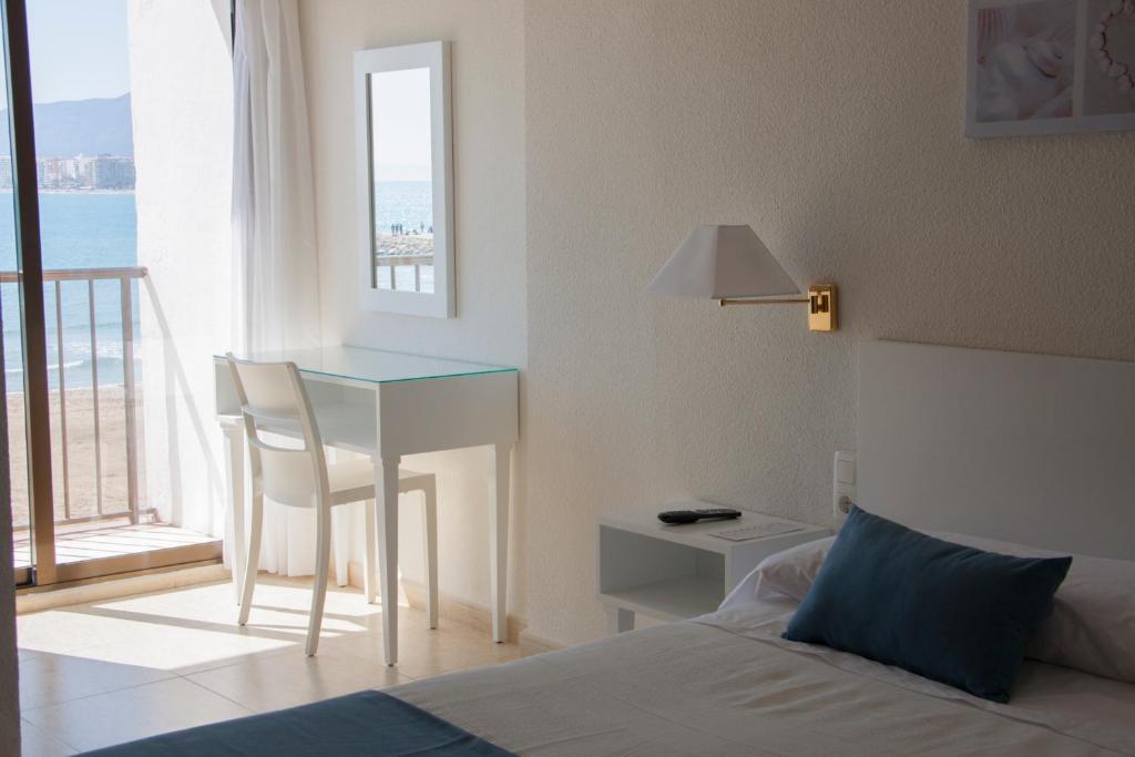 Postel nebo postele na pokoji v ubytování Hotel Sicania