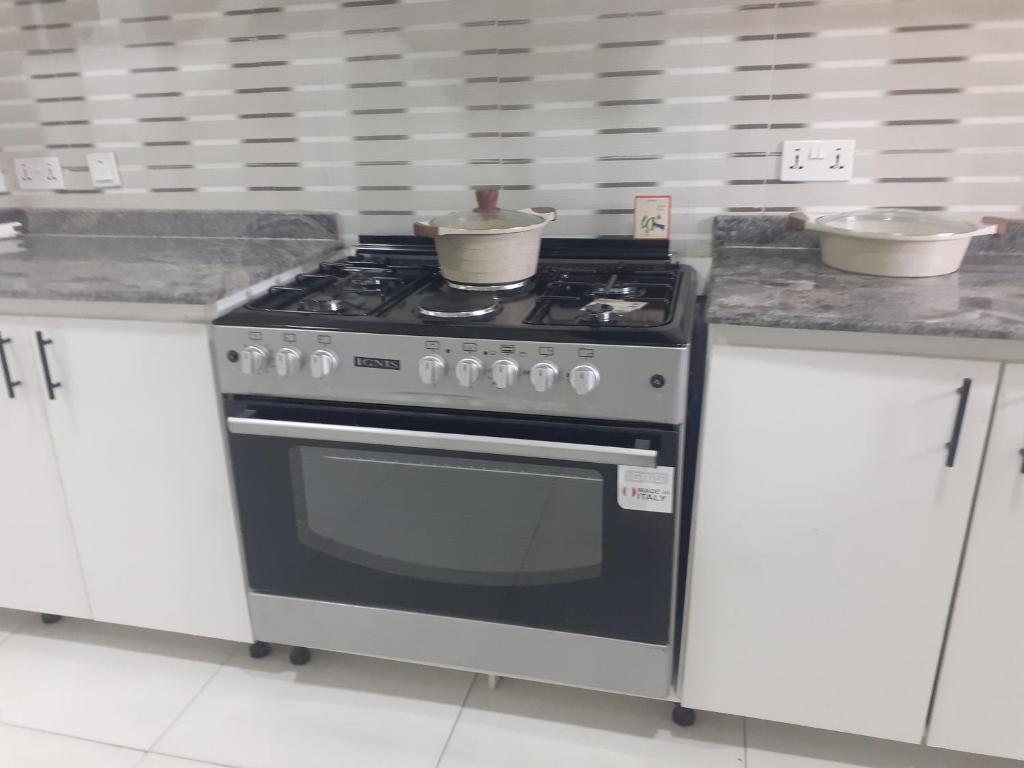 Kuchyň nebo kuchyňský kout v ubytování Whitestown apartments