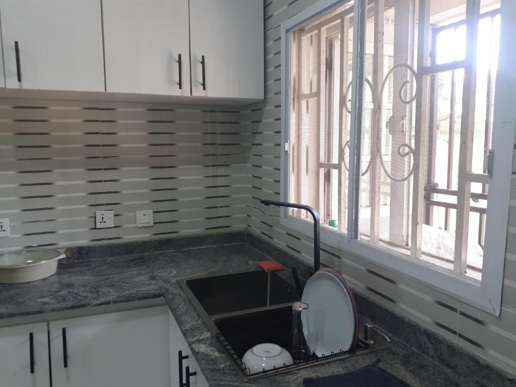 Kuchyň nebo kuchyňský kout v ubytování Whitestown apartments