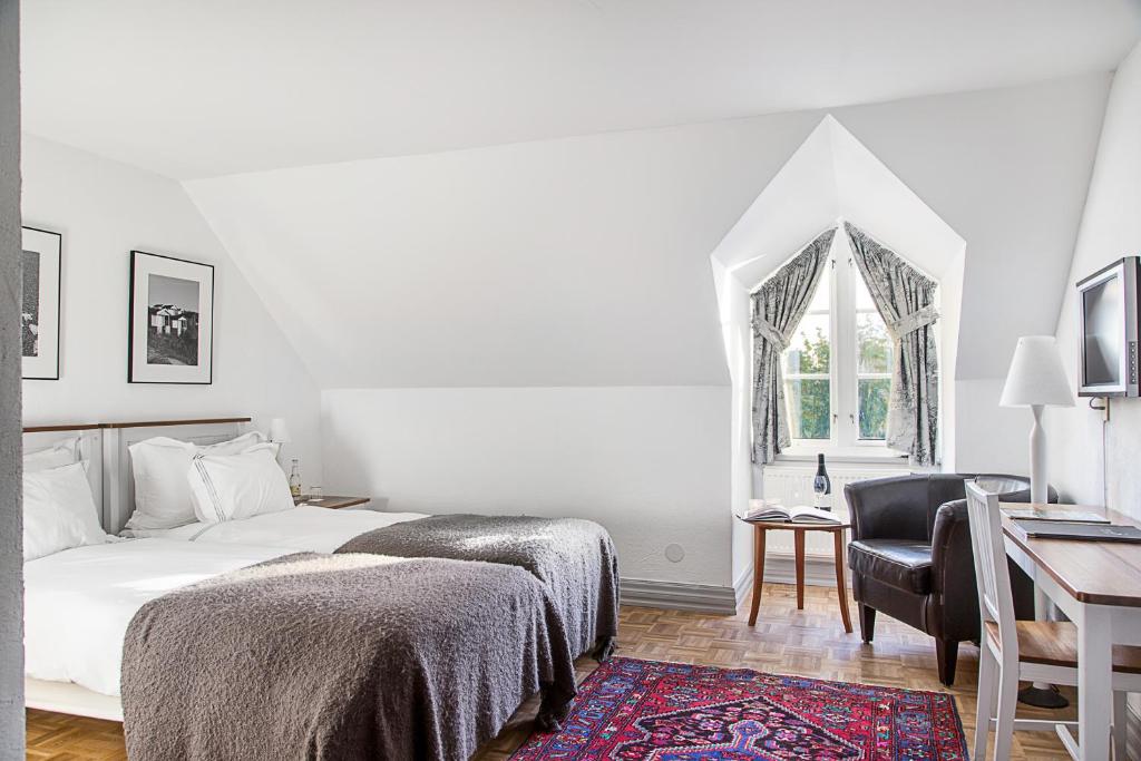 Postel nebo postele na pokoji v ubytování Hotell Gässlingen