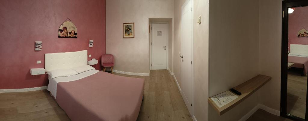 Postel nebo postele na pokoji v ubytování Hotel PRINCIPE AMEDEO