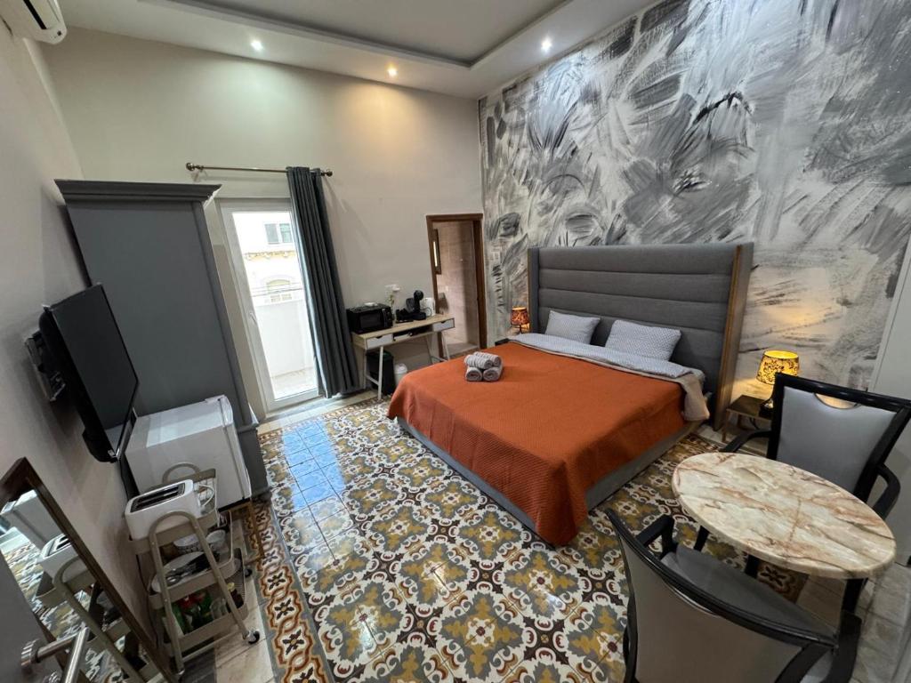 TV a/nebo společenská místnost v ubytování MH Sliema by Malta Holidays