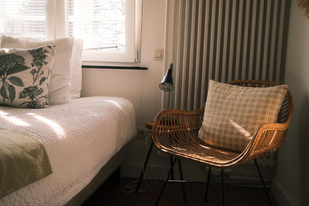 Postel nebo postele na pokoji v ubytování Vakantiewoning Guesthouse MOMO