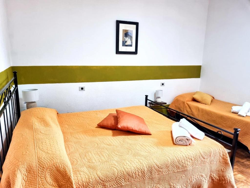 Postel nebo postele na pokoji v ubytování Agriturismo TERRANERA