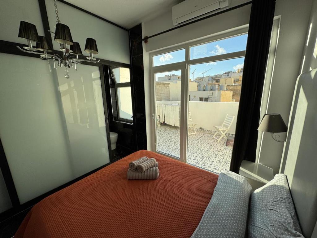 Postel nebo postele na pokoji v ubytování MH Sliema by Malta Holidays