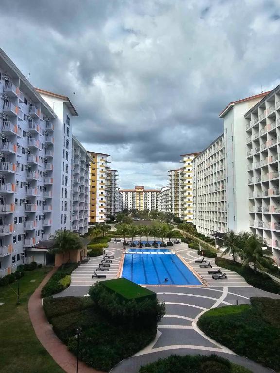 an aerial view of a resort with a swimming pool at SMDC Field REsidences condo unit in Manila