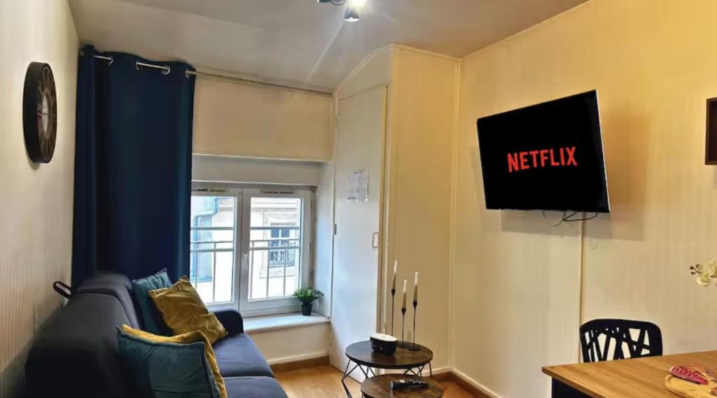 TV a/nebo společenská místnost v ubytování L'authentique Central - Gare
