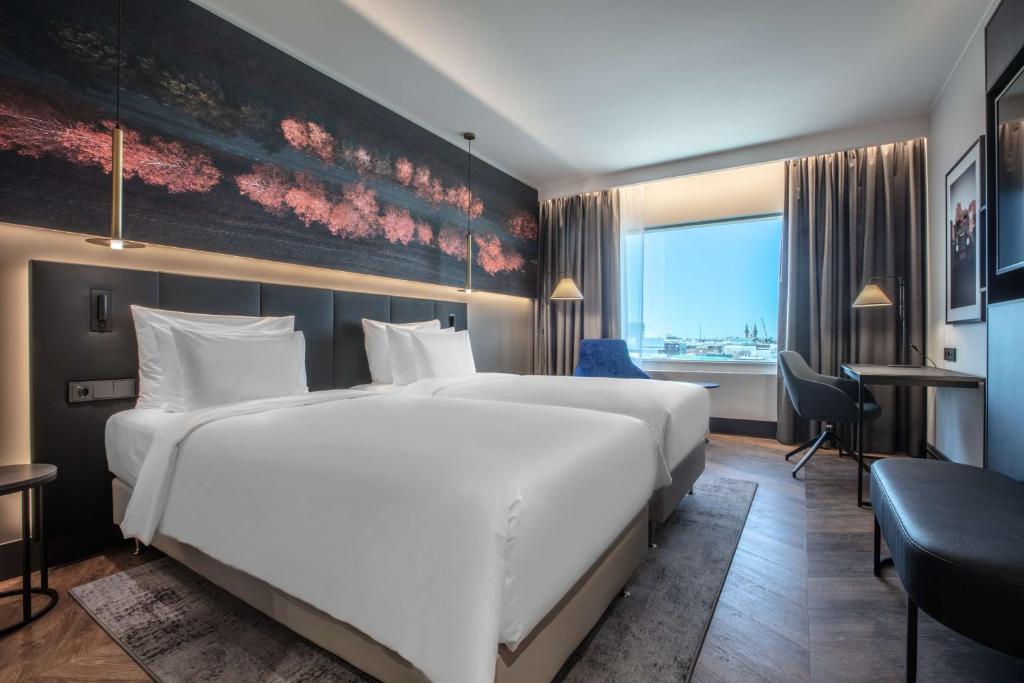 Postel nebo postele na pokoji v ubytování Radisson Collection Hotel, Tallinn