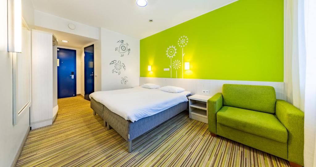 Postel nebo postele na pokoji v ubytování Tallink Express Hotel