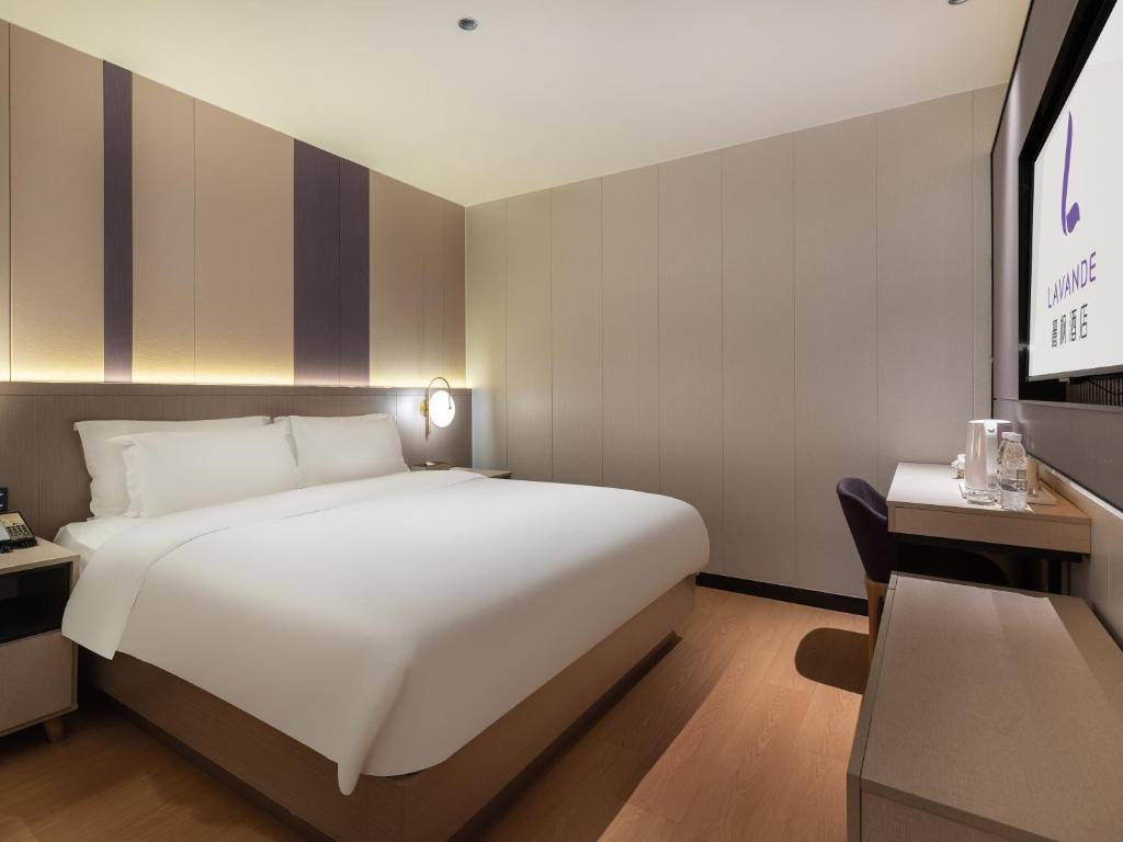 Postel nebo postele na pokoji v ubytování Lavande International Hotel Guangzhou US Consulate General Guangzhou Grandview Plaza Branch - Free Shuttle Bus to Canton Fair Complex During Canton Fair Period & Free VPN Internet Access