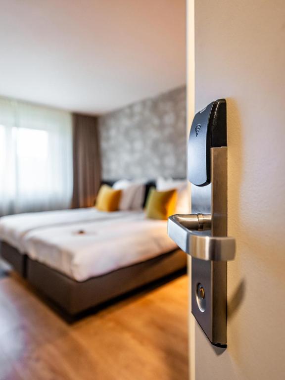 Postel nebo postele na pokoji v ubytování Bloomhotel