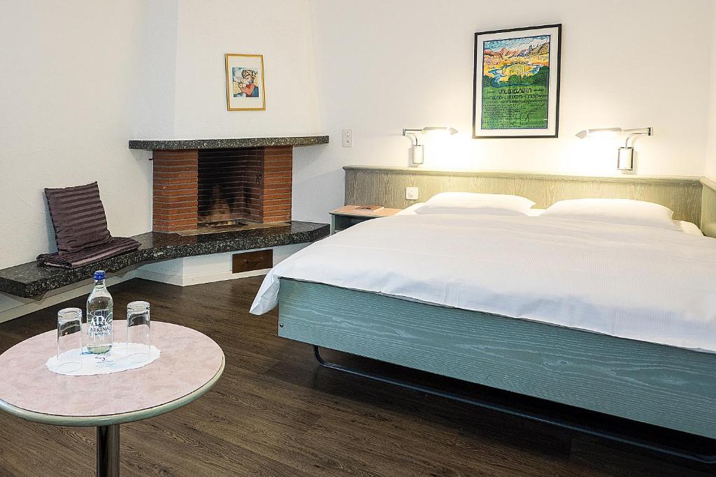 Postel nebo postele na pokoji v ubytování Sommerau-Ticino Swiss Quality Hotel