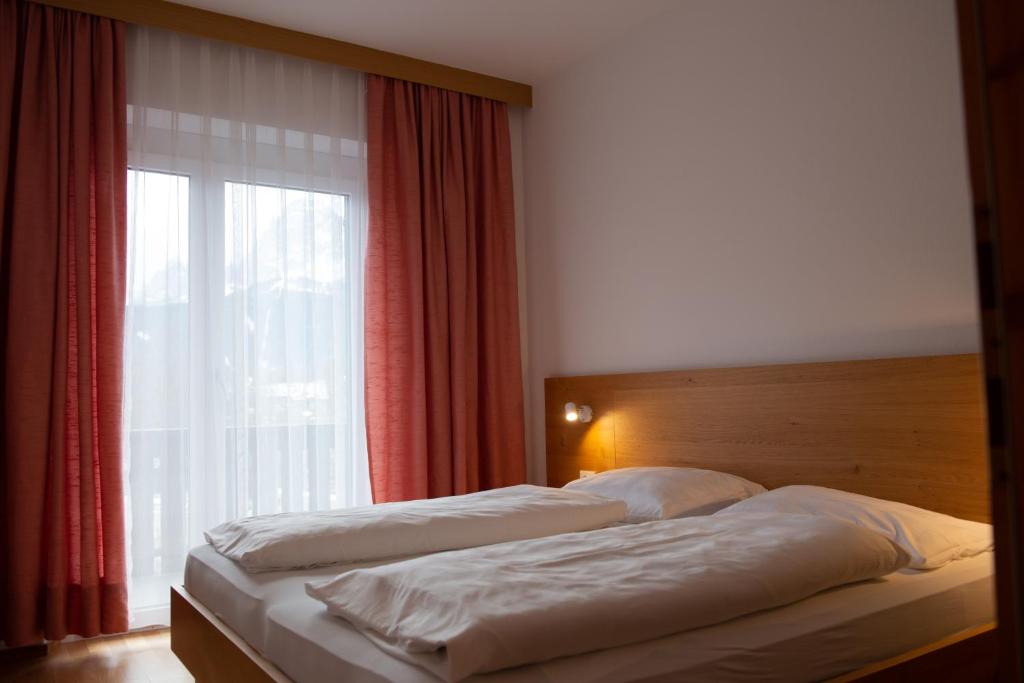 Postel nebo postele na pokoji v ubytování Garni Hofer