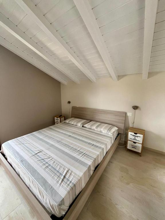 Postel nebo postele na pokoji v ubytování B&B Aria Di Lago