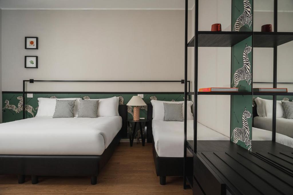 Postel nebo postele na pokoji v ubytování Hotel Vagabond