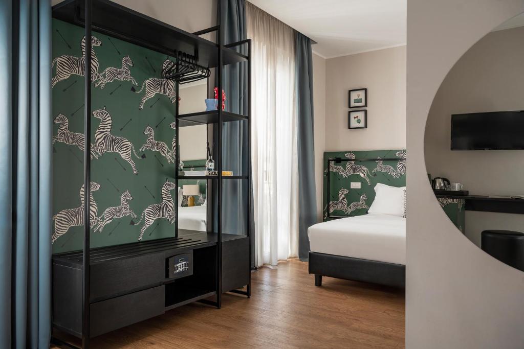 Postel nebo postele na pokoji v ubytování Hotel Vagabond
