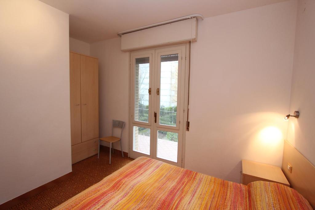A bed or beds in a room at Tamerici