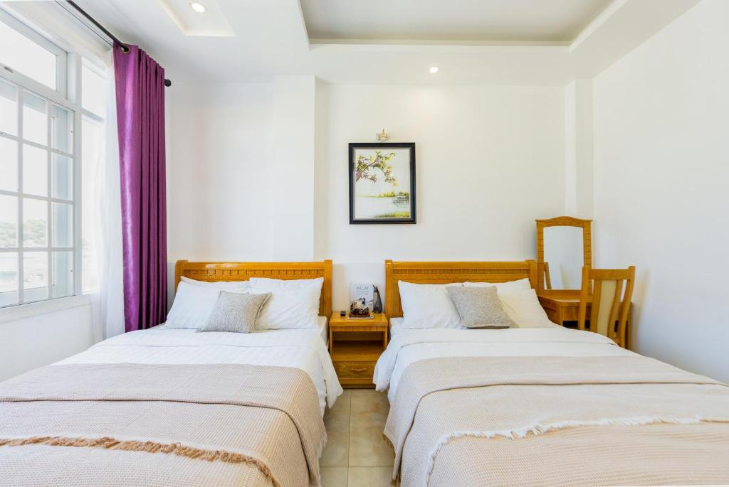 Giường trong phòng chung tại AM Memory Central Hotel 2