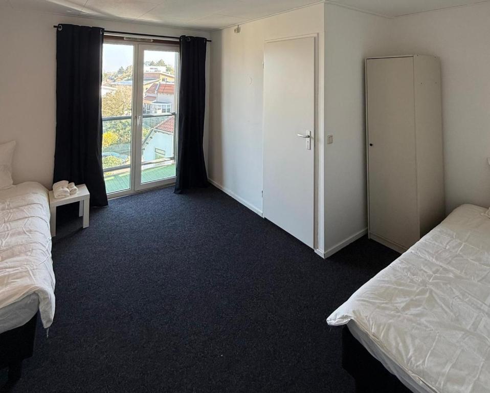 Voodi või voodid majutusasutuse Victor hotel toas