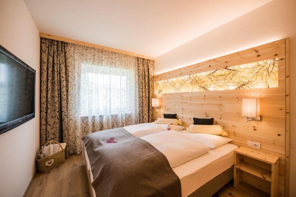 Posteľ alebo postele v izbe v ubytovaní Apartments Drei Zinnen