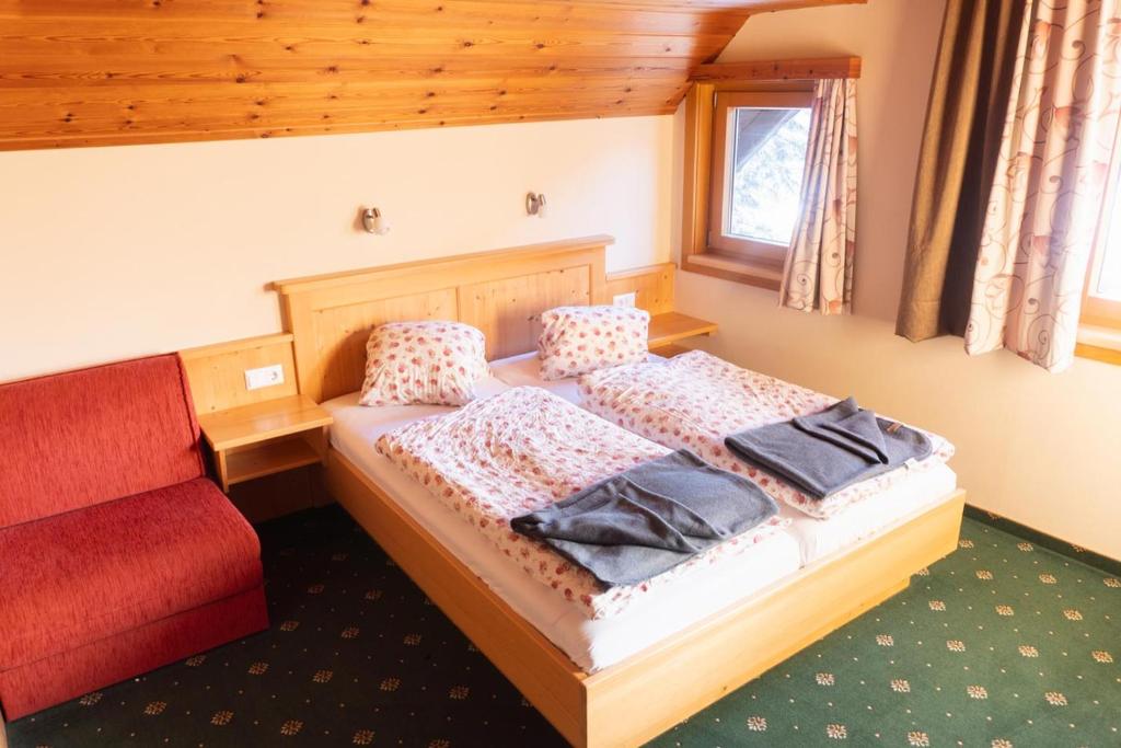 Postel nebo postele na pokoji v ubytování Pension Trillerhof