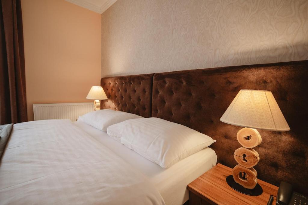 Postel nebo postele na pokoji v ubytování Hotel Solisko