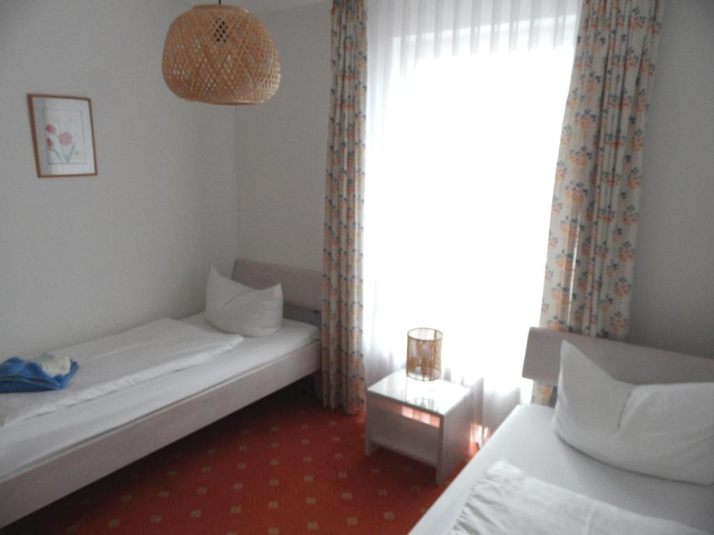 Postel nebo postele na pokoji v ubytování Haus Buchenhof