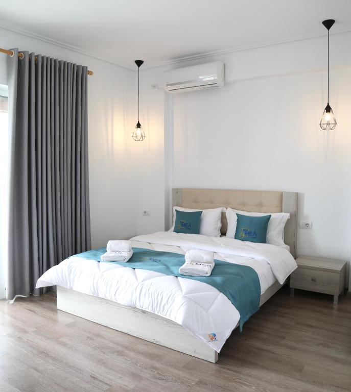 Postel nebo postele na pokoji v ubytování Relax Mea Hotel
