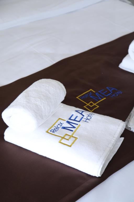 Postel nebo postele na pokoji v ubytování Relax Mea Hotel