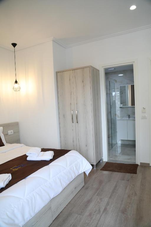 Postel nebo postele na pokoji v ubytování Relax Mea Hotel