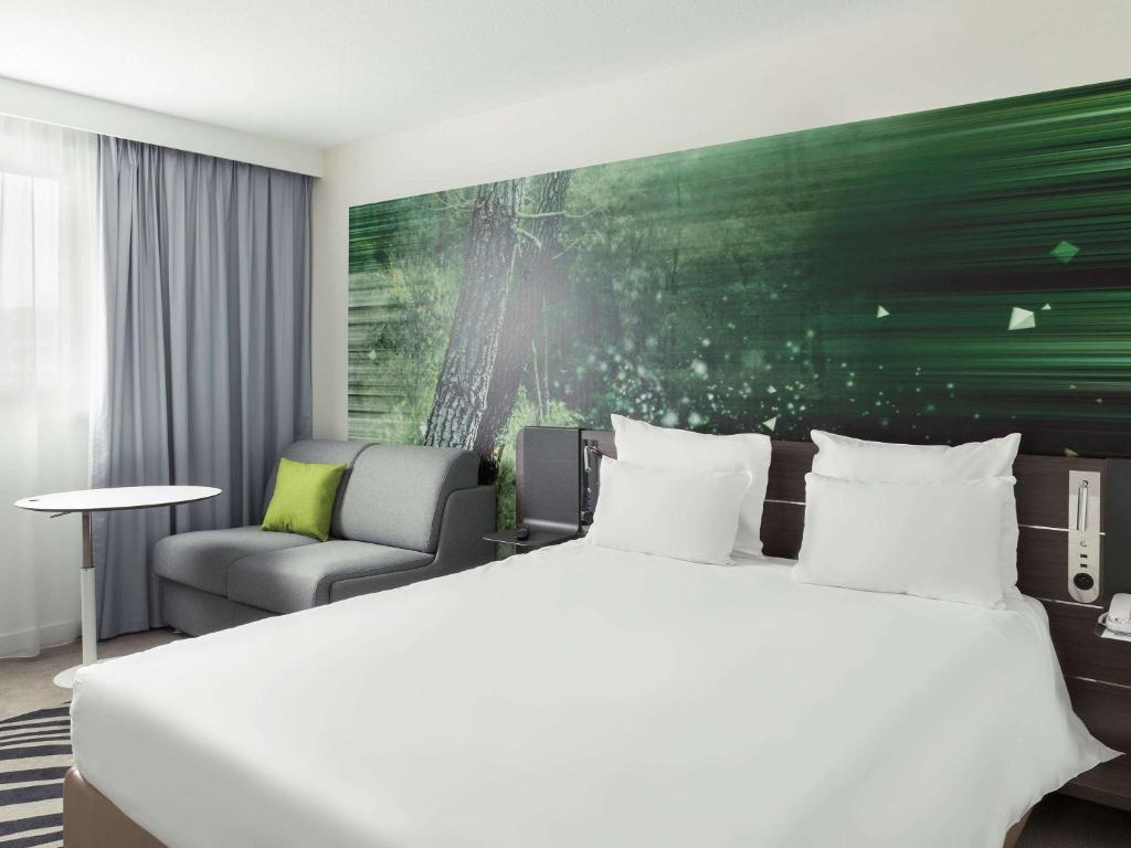 Postel nebo postele na pokoji v ubytování Novotel Paris Charles de Gaulle Airport