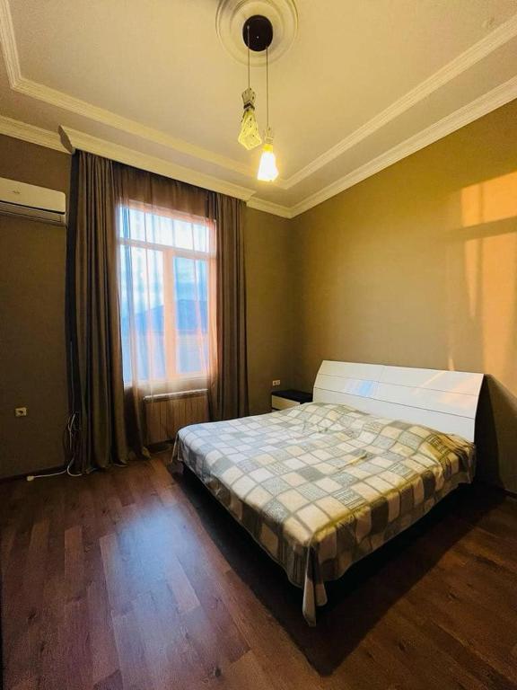 Postel nebo postele na pokoji v ubytování Guest House ZUGDIDI INN
