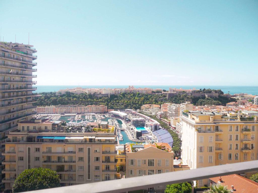 a view of a city from a building at Novotel Monte-Carlo in Monte Carlo