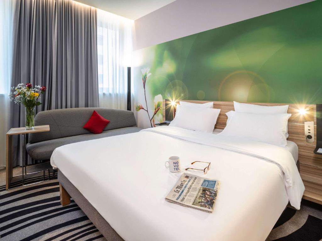 Postel nebo postele na pokoji v ubytování Novotel Wien City
