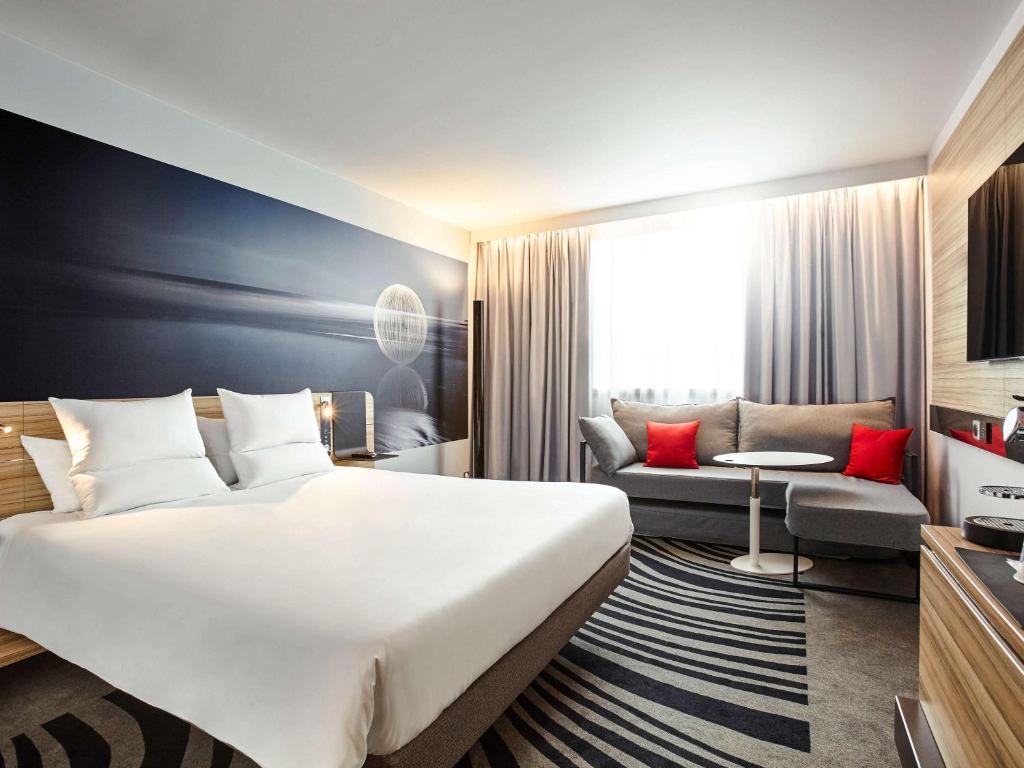 Postel nebo postele na pokoji v ubytování Novotel Wien City