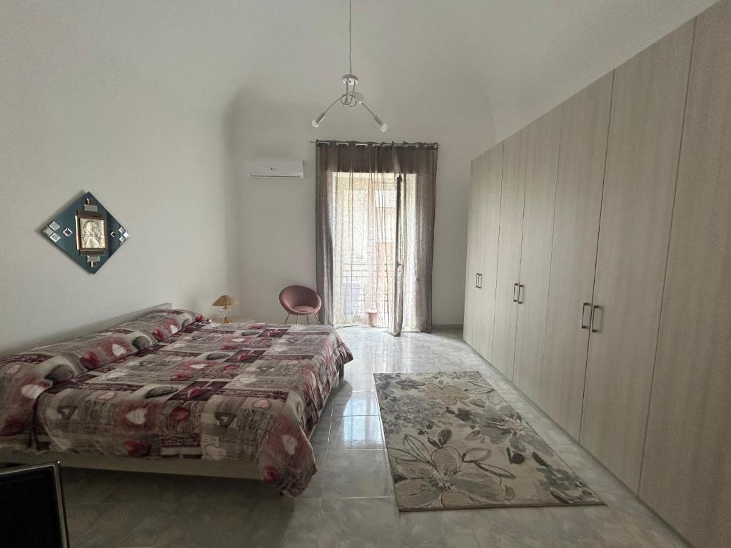 Łóżko lub łóżka w pokoju w obiekcie Casa vacanza da Paola