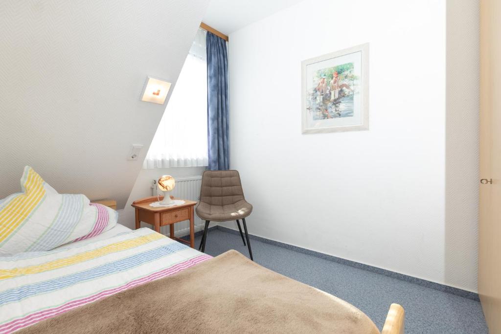 Postel nebo postele na pokoji v ubytování Haus Insa 143 - Ferienwohnung 3