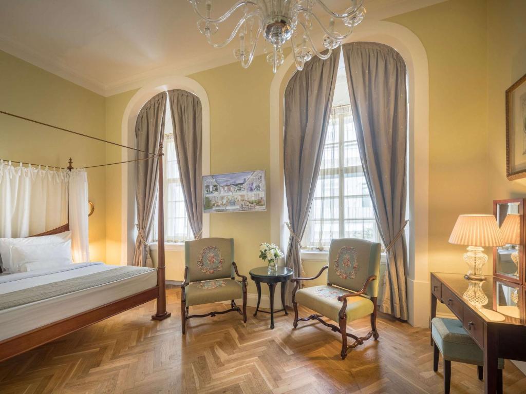 Łóżko lub łóżka w pokoju w obiekcie The Mozart Prague