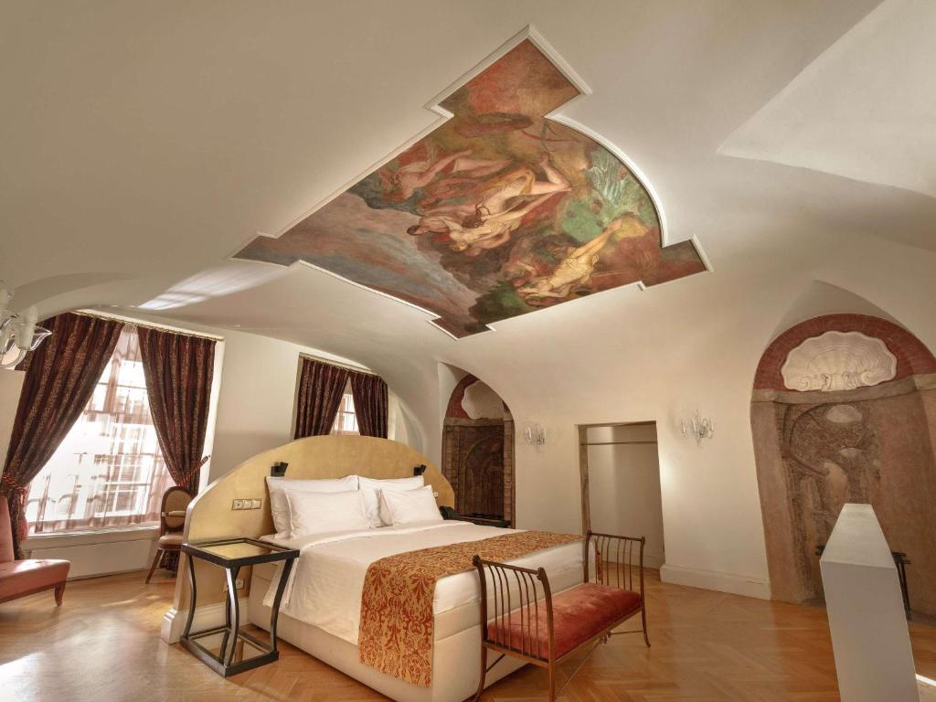 Łóżko lub łóżka w pokoju w obiekcie The Mozart Prague