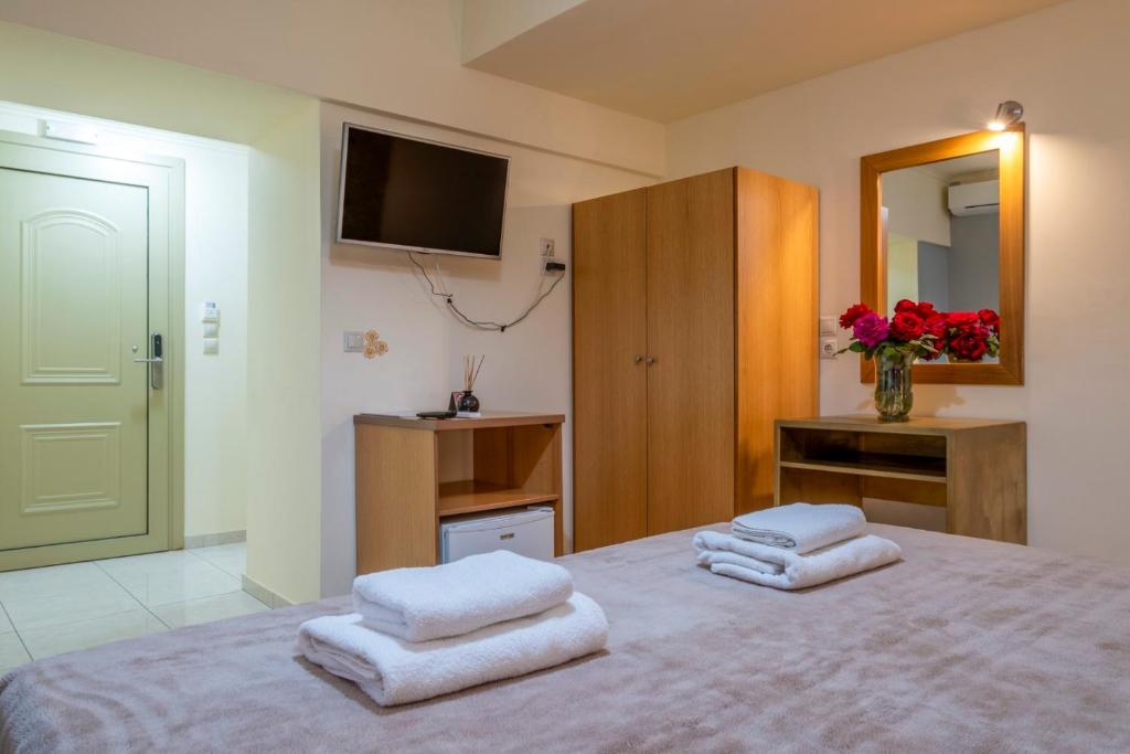 Posteľ alebo postele v izbe v ubytovaní Areti Suites